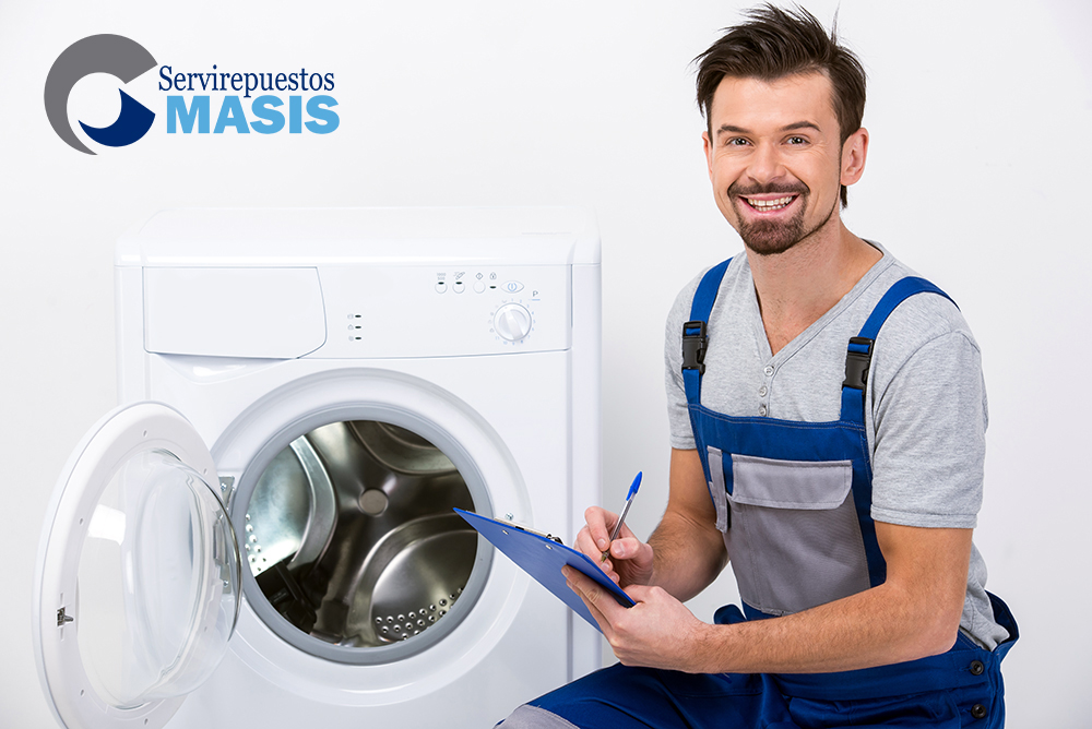 Repairman is repairing a washing machine.